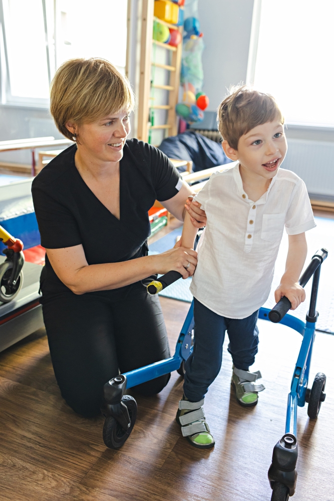 Handsome,Young,Boy,With,Movement,Disorders,Practices,Walking,With,Support